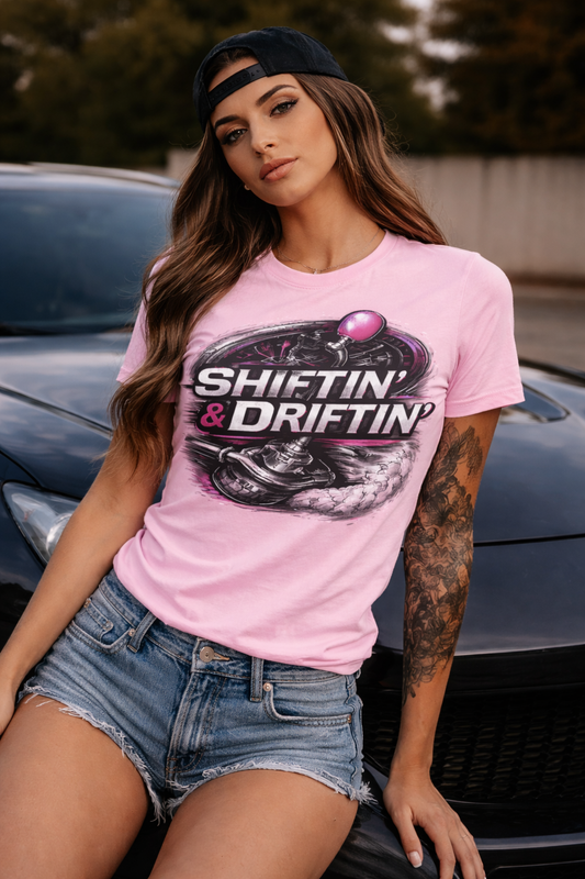 Woman wearing pink Shiftin’ & Driftin’ motorsports t-shirt with hot-pink graphic, unisex fit by Throttle & Thread
